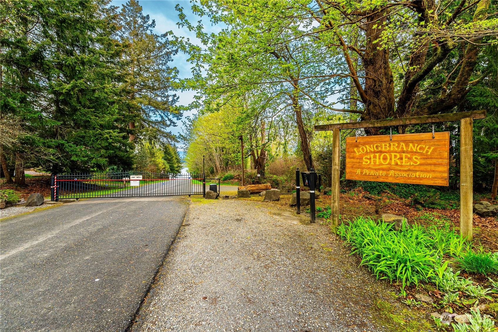 9214 163rd Avenue Southwest Longbranch, WA 98351 - Photo 2 of 31 a view of swimming pool with outdoor seating and trees in the background
