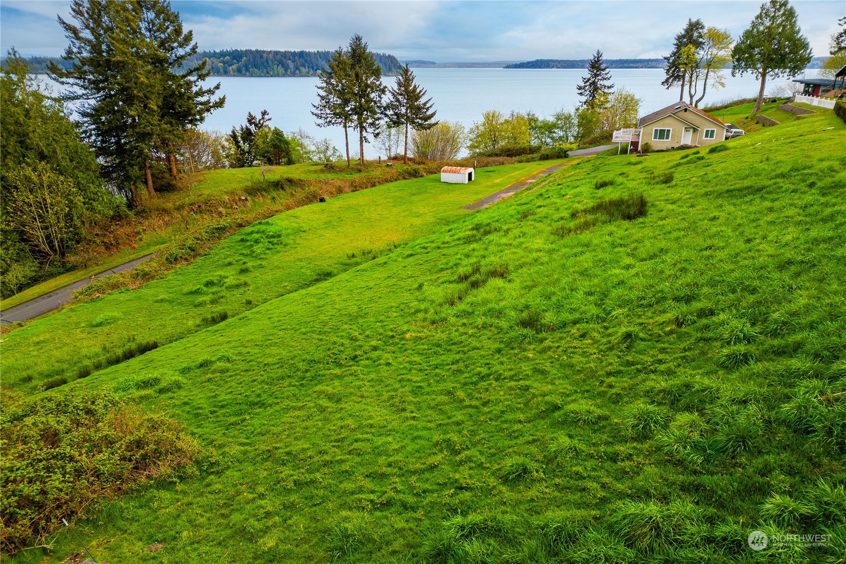 9214 163rd Avenue Southwest Longbranch, WA 98351 - Photo 24 of 31 a view of yard with swimming pool and green space