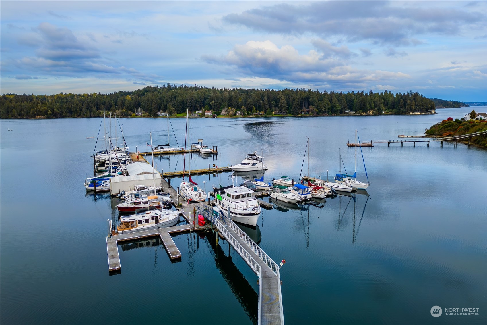9214 163rd Avenue Southwest Longbranch, WA 98351 - Photo 30 of 31 a view of a lake with sitting area