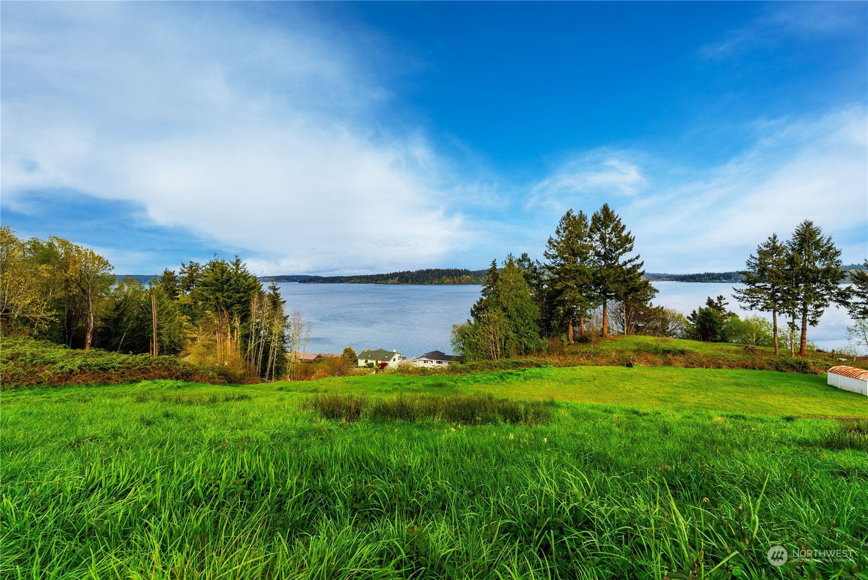 9214 163rd Avenue Southwest Longbranch, WA 98351 - Photo 4 of 31 a backyard of a house with table and chairs