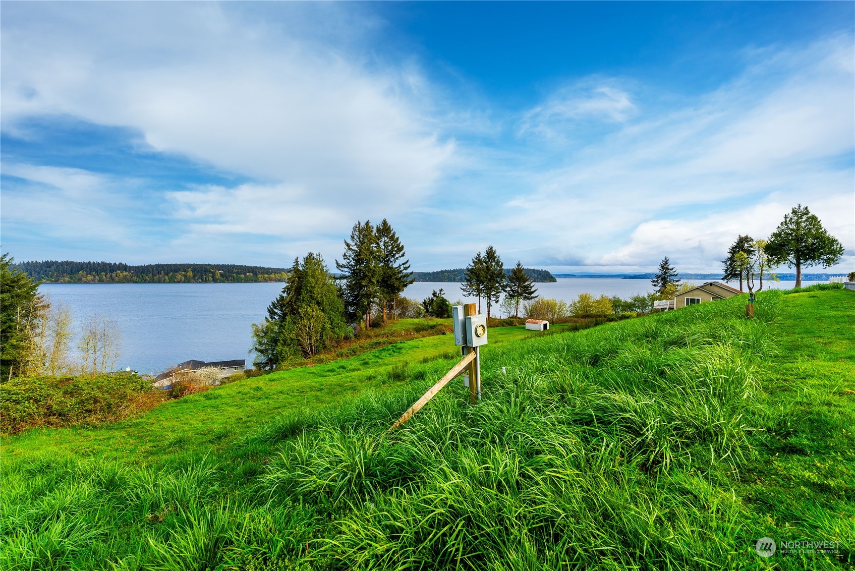 9214 163rd Avenue Southwest Longbranch, WA 98351 - Photo 8 of 31 a view of a lake with a big yard