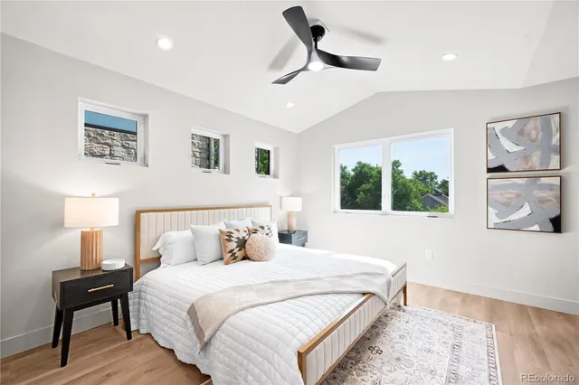 a bedroom with a large bed and a window