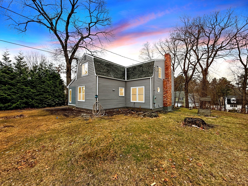 21 Burlington Road Billerica, MA 01821 - Photo 1 of 42 a backyard of a house with table and chairs
