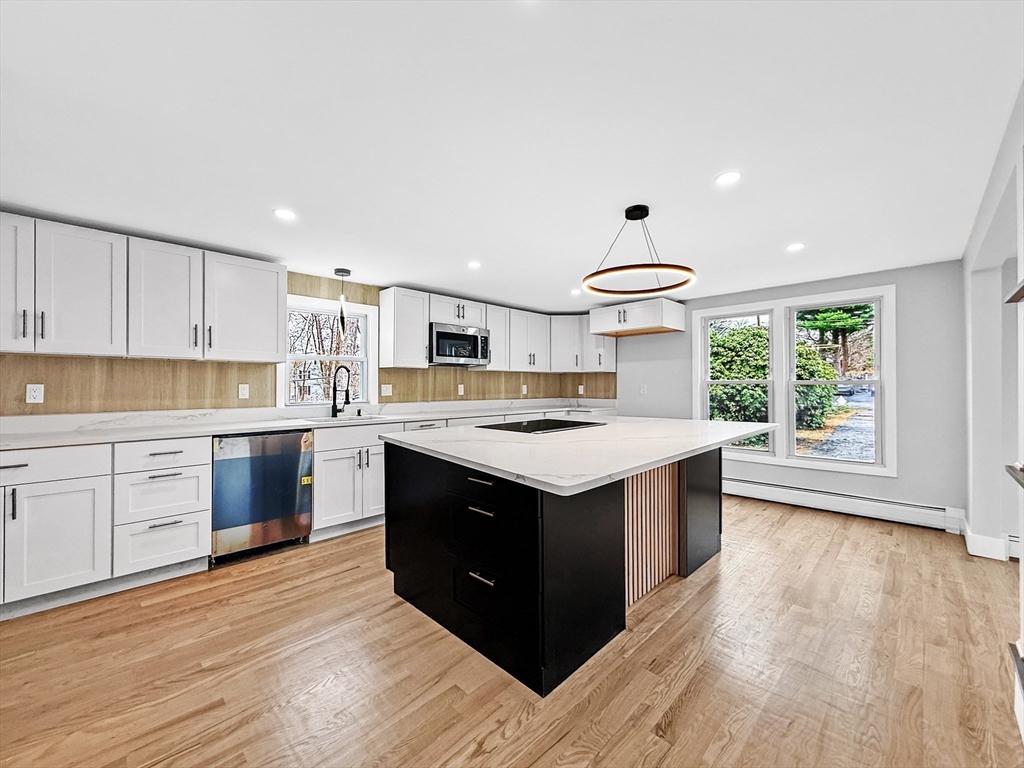 21 Burlington Road Billerica, MA 01821 - Photo 16 of 42 a kitchen with stainless steel appliances granite countertop a stove and a sink