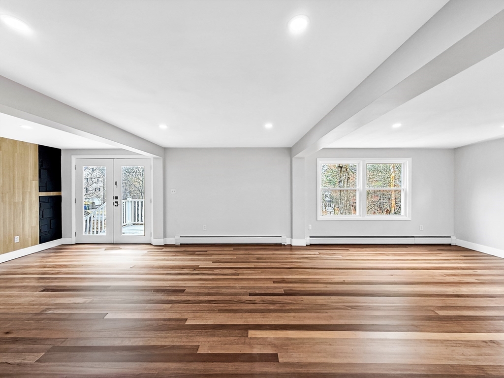 21 Burlington Road Billerica, MA 01821 - Photo 19 of 42 a view of an empty room with wooden floor and a window