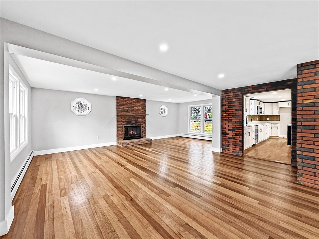 21 Burlington Road Billerica, MA 01821 - Photo 22 of 42 a view of an empty room with wooden floor and a window