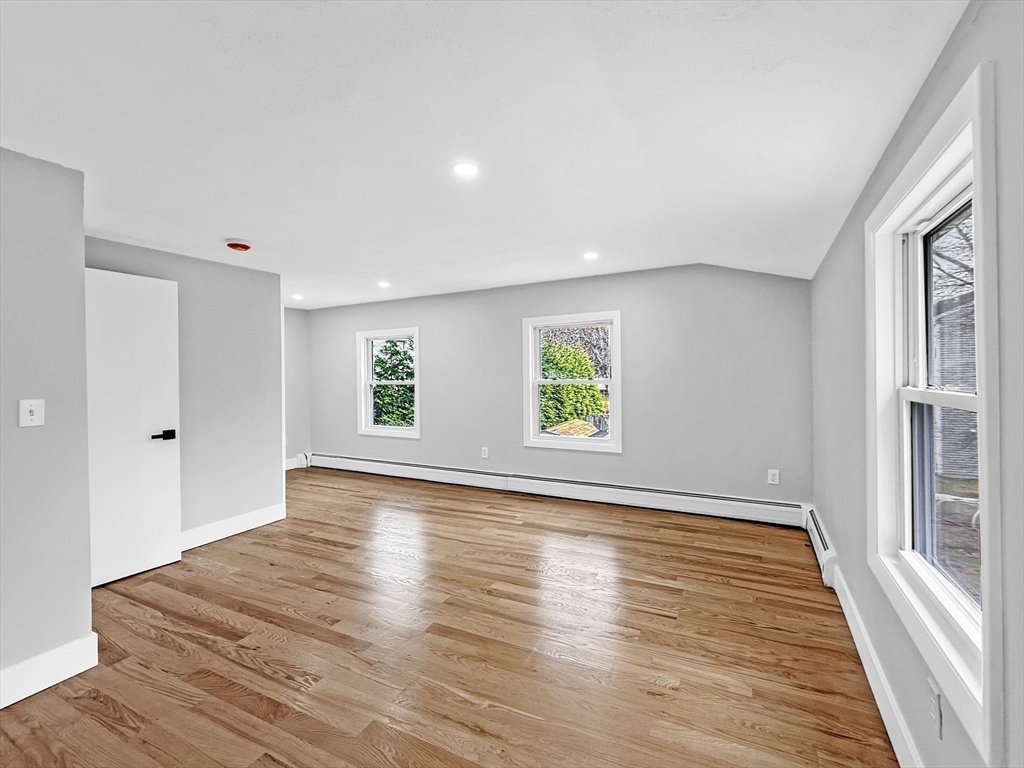21 Burlington Road Billerica, MA 01821 - Photo 30 of 42 a view of an empty room with wooden floor and a window