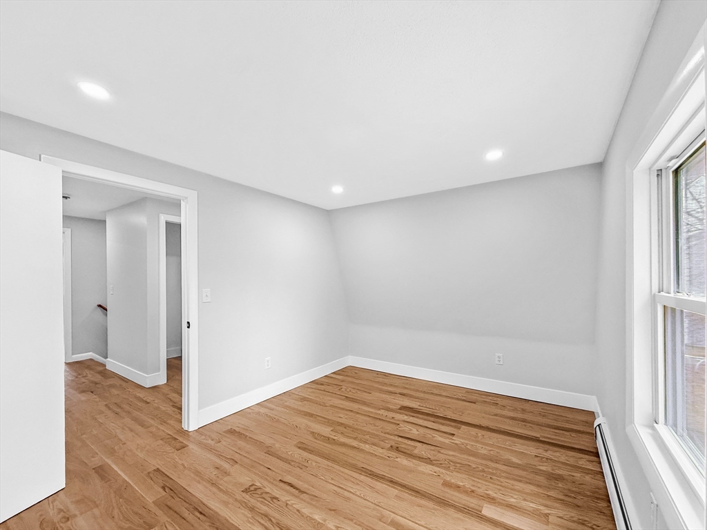 21 Burlington Road Billerica, MA 01821 - Photo 32 of 42 a view of empty room with wooden floor and fan