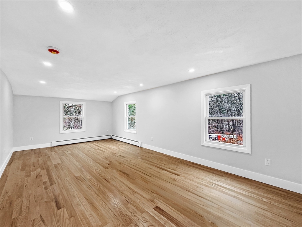 21 Burlington Road Billerica, MA 01821 - Photo 33 of 42 a view of an empty room with wooden floor and a window