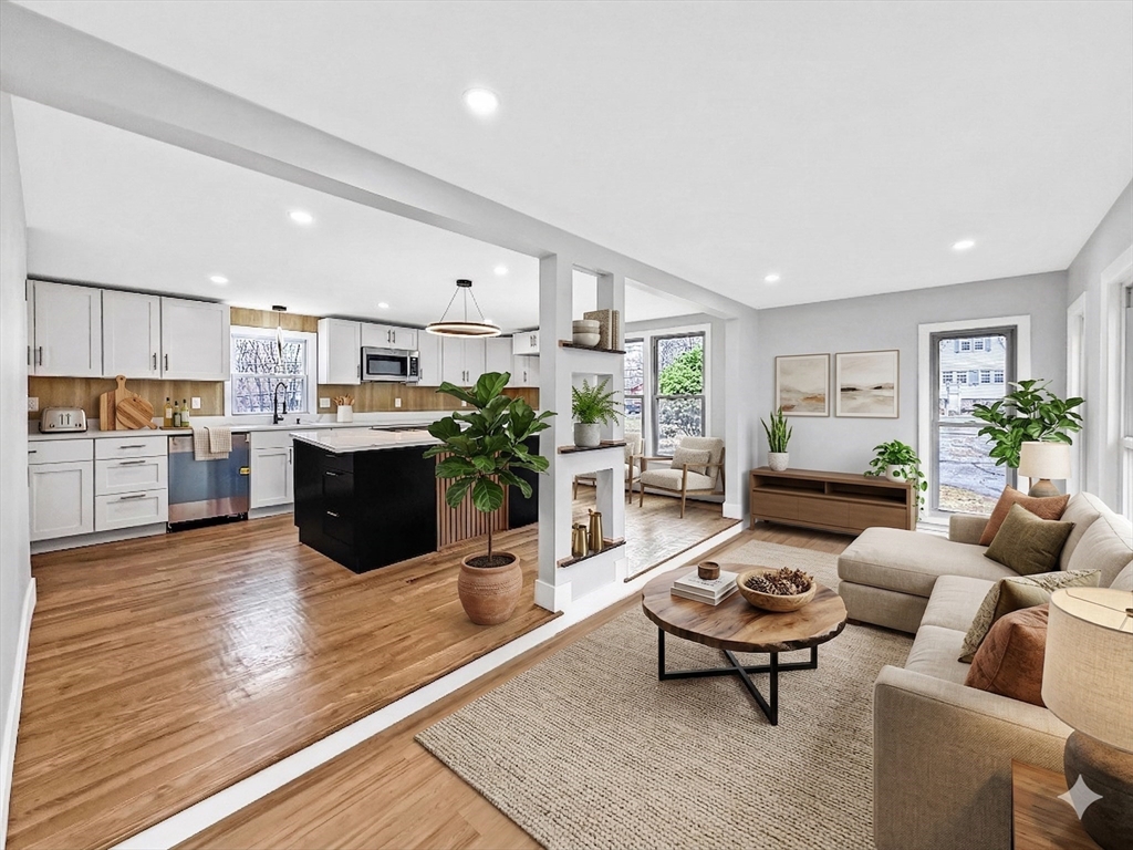21 Burlington Road Billerica, MA 01821 - Photo 5 of 42 a living room with furniture and a kitchen view