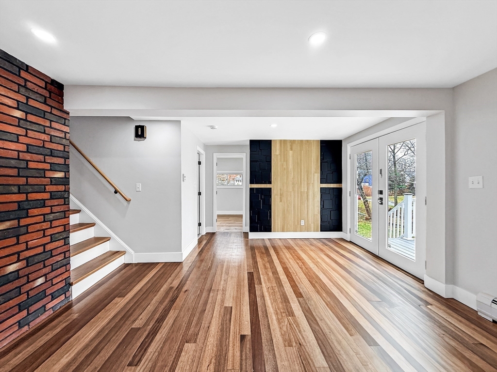 21 Burlington Road Billerica, MA 01821 - Photo 6 of 42 a view of a room with wooden floor and stairs