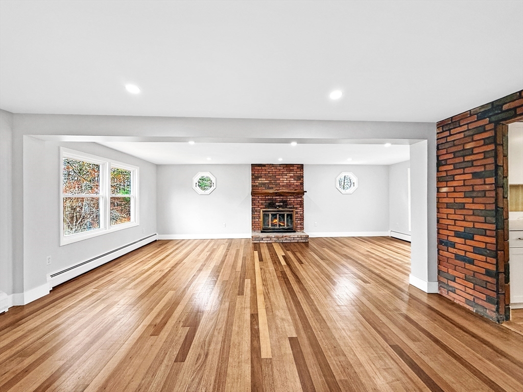 21 Burlington Road Billerica, MA 01821 - Photo 8 of 42 wooden floor in an empty room with a window