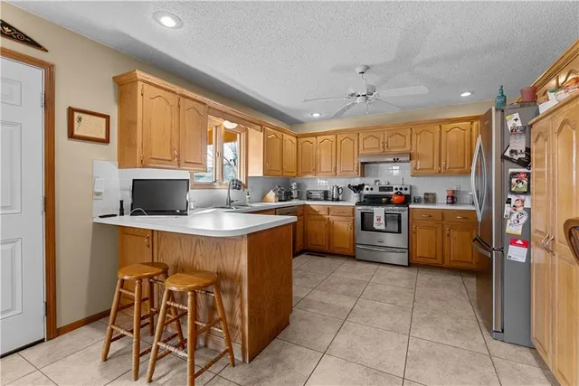 $319,999 | 1629 Northeast Whitestone Drive, Lee's Summit, MO 64086