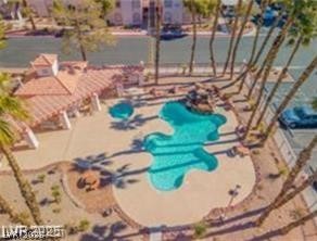 7570 West Flamingo Road, Unit 125 Las Vegas, NV 89147 - Photo 21 of 29 View of swimming pool with a pool and a pergola
