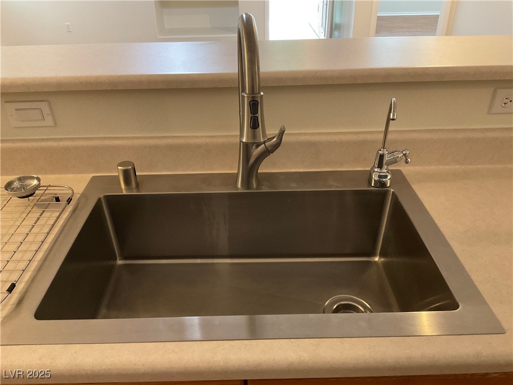 7620 Donald Nelson Avenue Las Vegas, NV 89131 - Photo 11 of 34 Kitchen view of a sink and light countertops