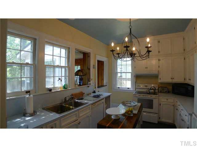 317 Dixie Trail, Unit 2 Raleigh, NC 27607 - Photo 11 of 25 a kitchen with a sink stove and refrigerator