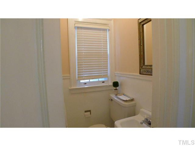317 Dixie Trail, Unit 2 Raleigh, NC 27607 - Photo 12 of 25 a bathroom with a sink a mirror and a bathtub