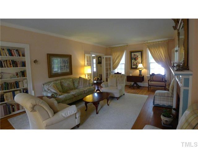 317 Dixie Trail, Unit 2 Raleigh, NC 27607 - Photo 14 of 25 a living room with furniture window and a flat screen tv