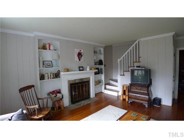 317 Dixie Trail, Unit 2 Raleigh, NC 27607 - Photo 21 of 25 a living room with furniture and a fireplace