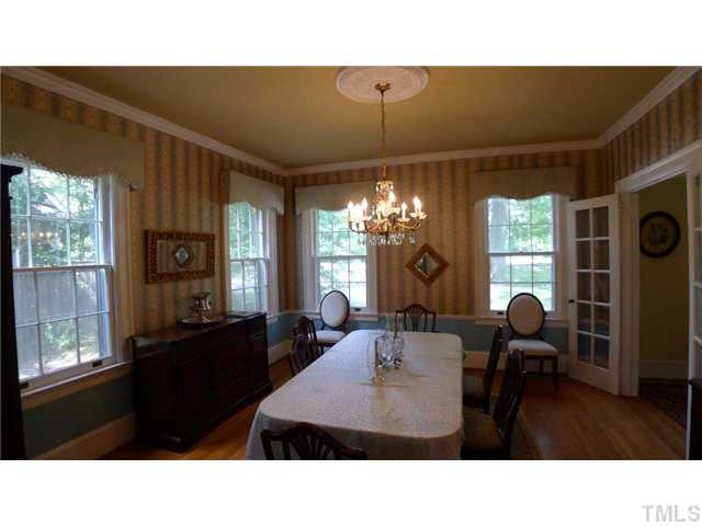 317 Dixie Trail, Unit 2 Raleigh, NC 27607 - Photo 8 of 25 a kitchen with a table chairs and windows