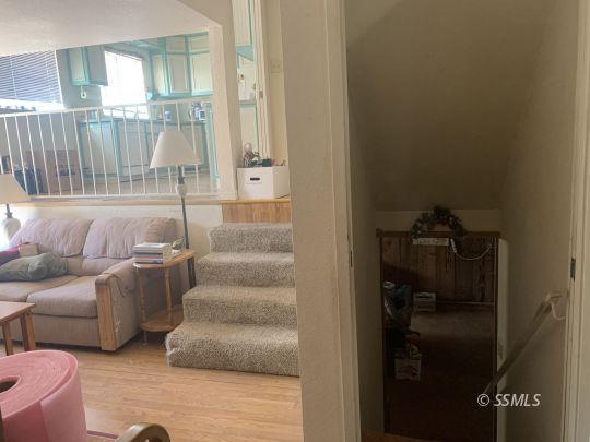 1221 North Garth Street Ridgecrest, CA 93555 - Photo 14 of 29 a living room with furniture and a glass door