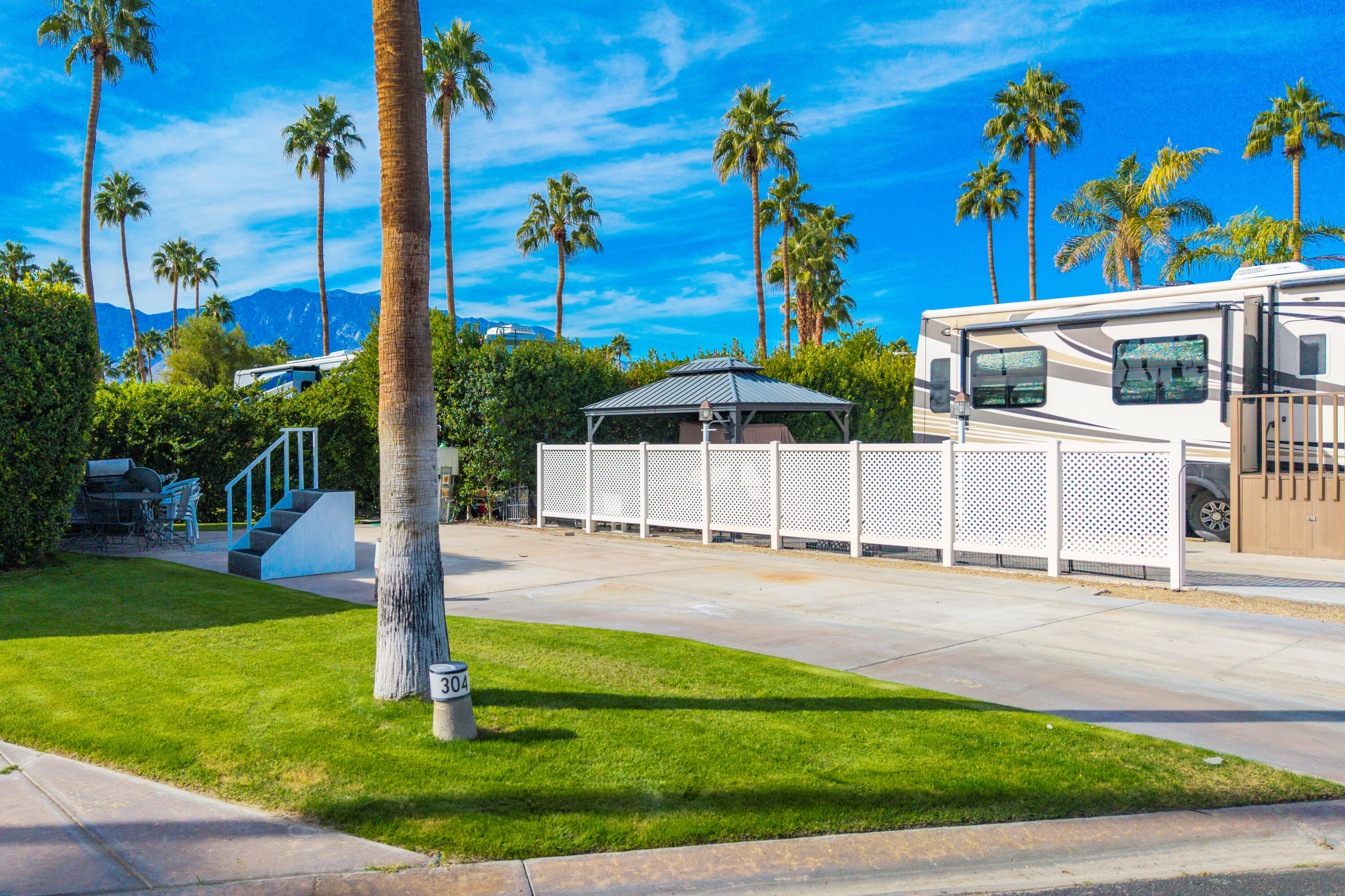 a swimming pool with lots of tress in front of it