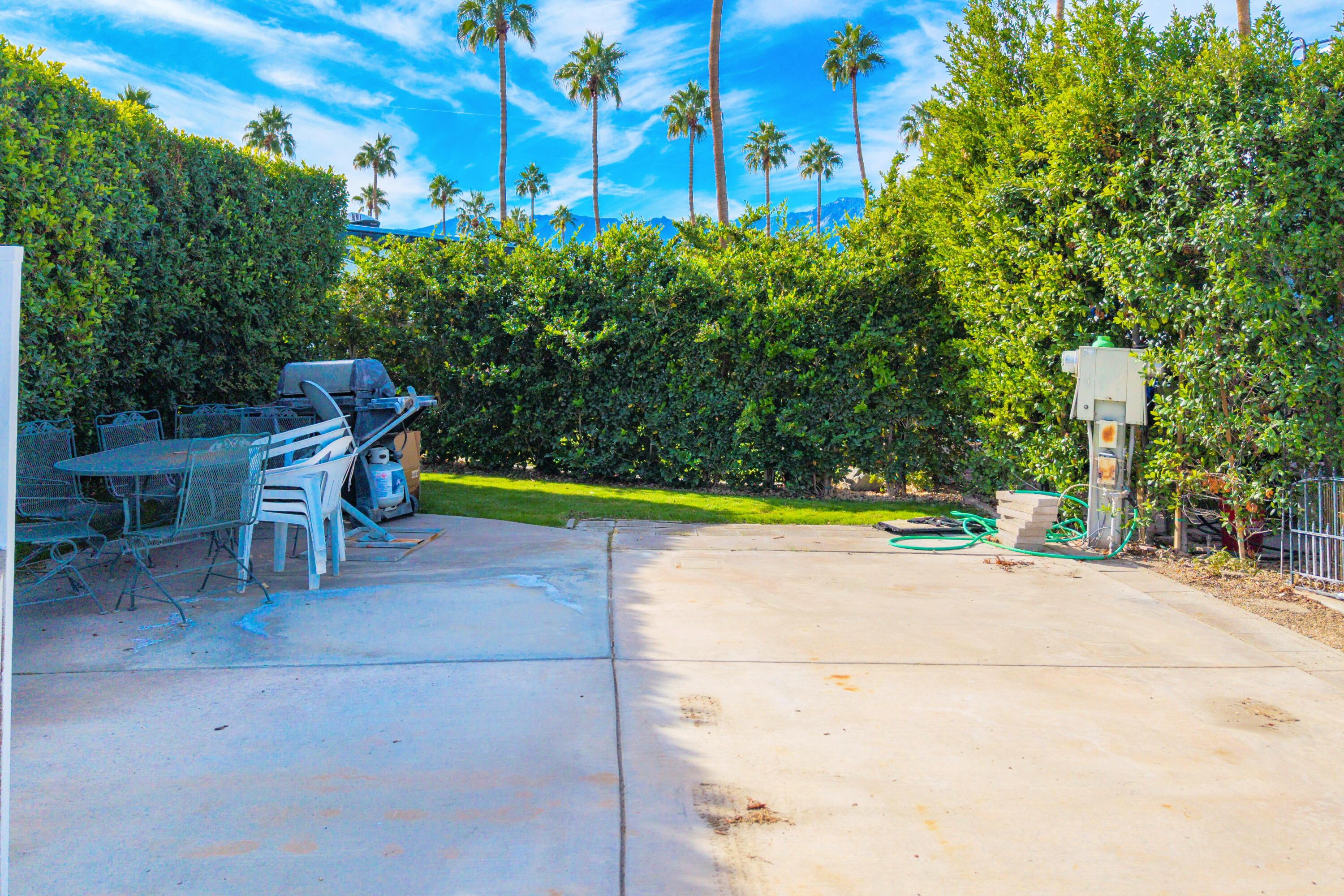 69411 Ramon Road, Unit 304 Cathedral City, CA 92234 - Photo 13 of 55 a view of a bench in a yard
