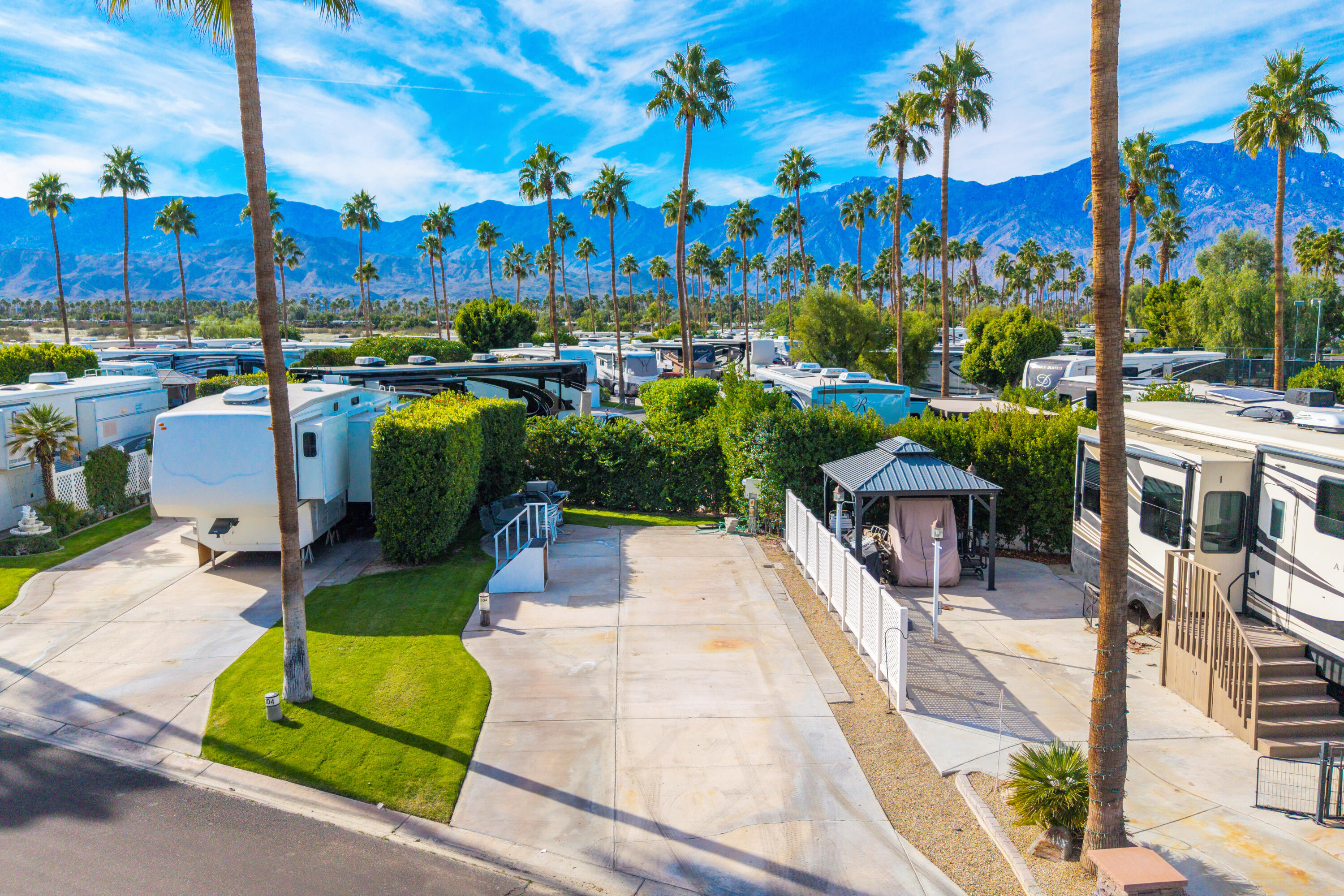 69411 Ramon Road, Unit 304 Cathedral City, CA 92234 - Photo 2 of 55 a view of a swimming pool and lounge chairs