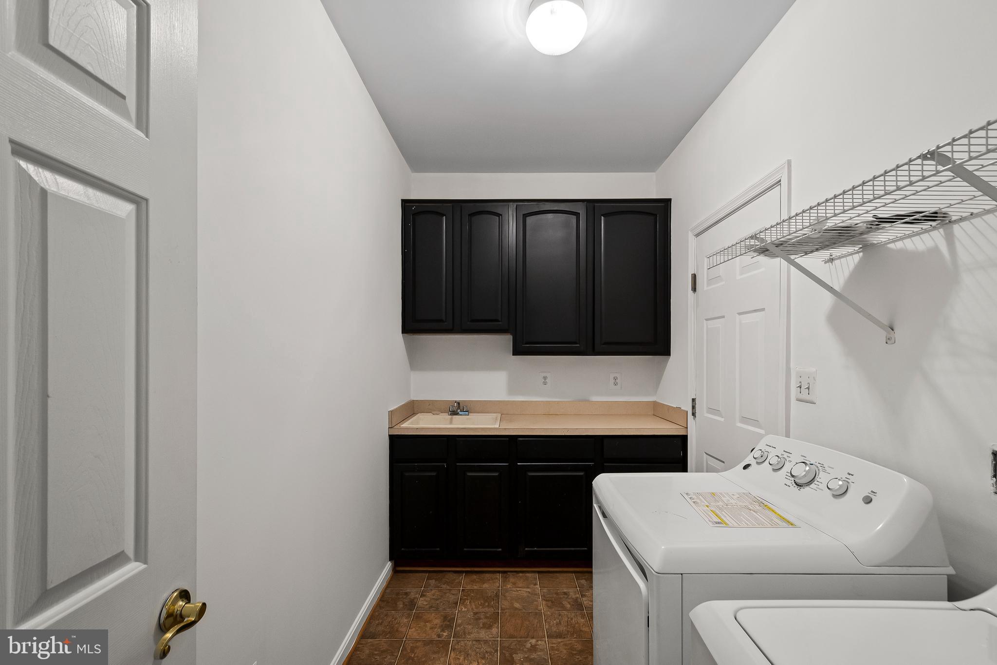 9015 Helmsley Drive Clinton, MD 20735 - Photo 14 of 53 a utility room with dryer and washer