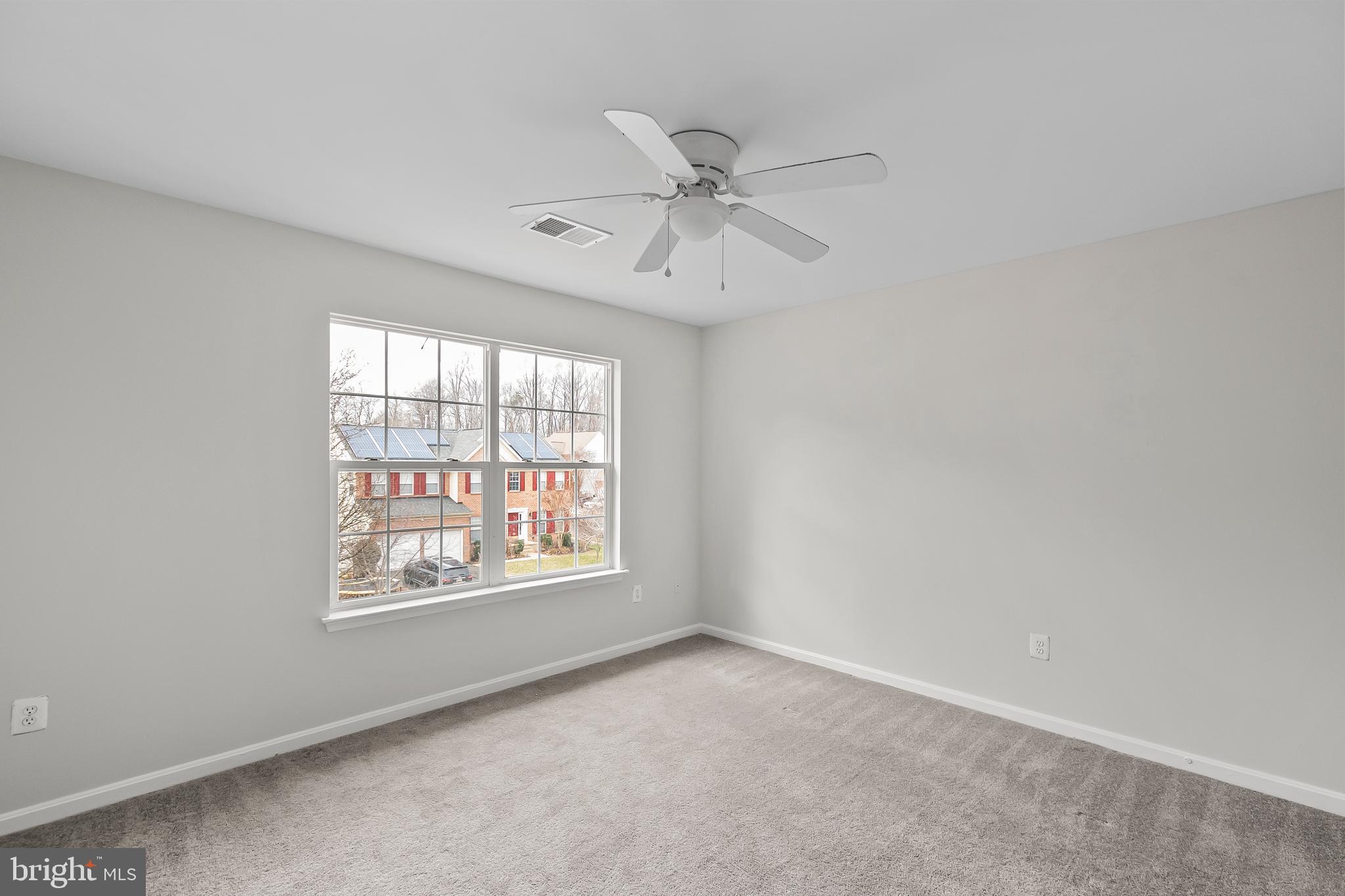 9015 Helmsley Drive Clinton, MD 20735 - Photo 21 of 53 an empty room with windows and fan