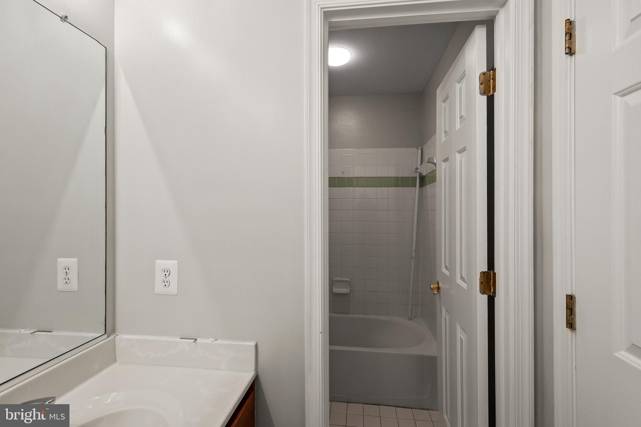 9015 Helmsley Drive Clinton, MD 20735 - Photo 24 of 53 a bathroom with a bathtub