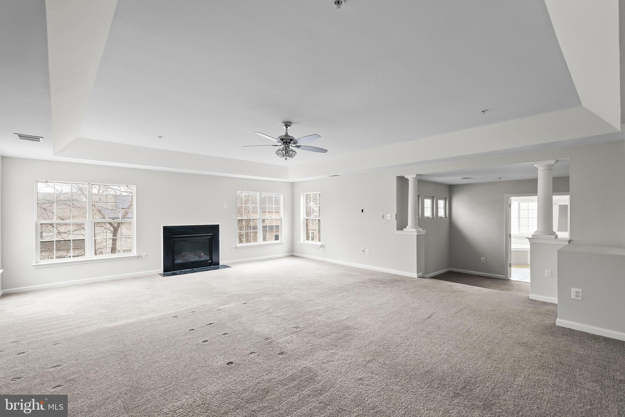 9015 Helmsley Drive Clinton, MD 20735 - Photo 34 of 53 an empty room with windows and fireplace