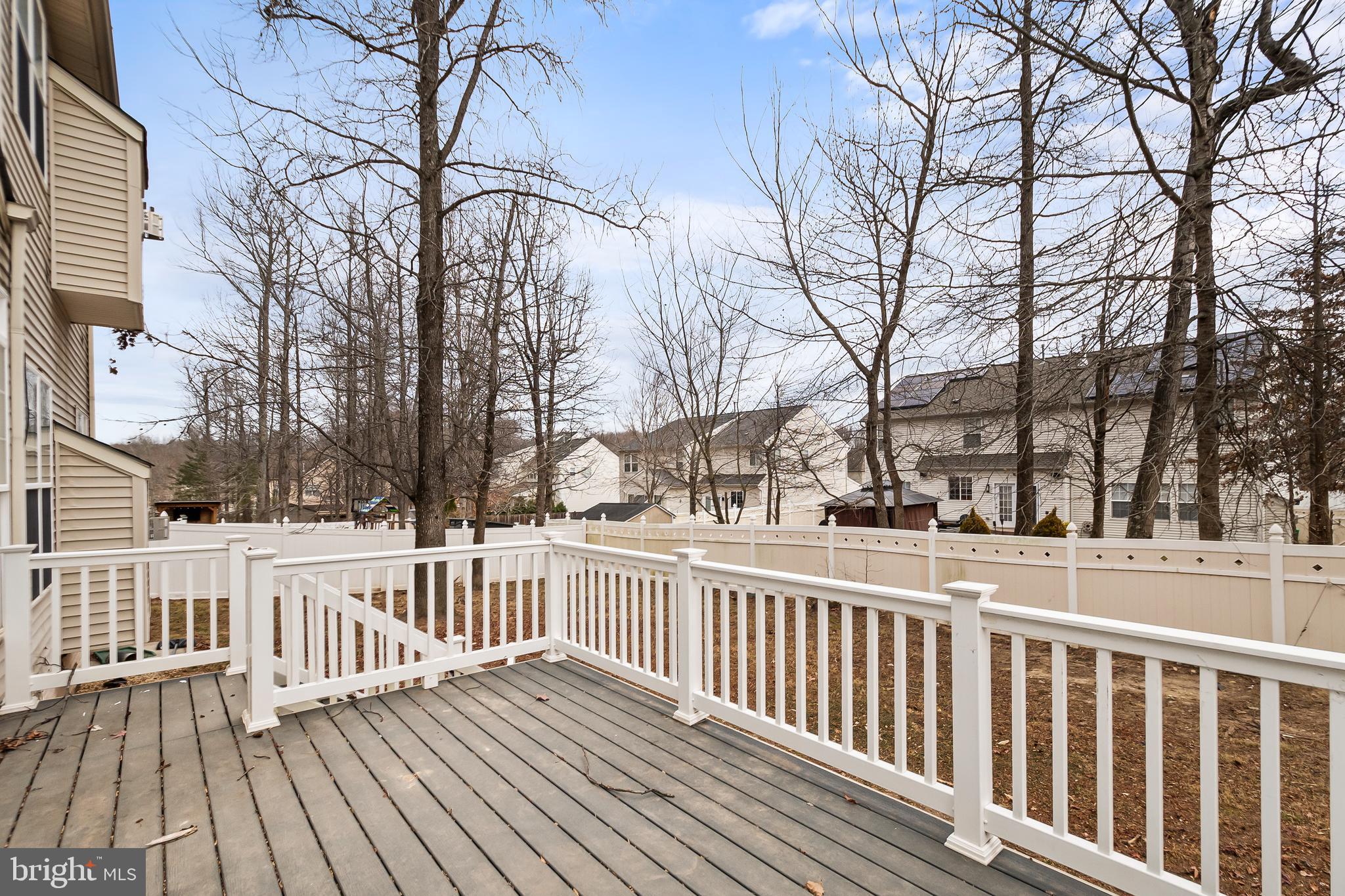 9015 Helmsley Drive Clinton, MD 20735 - Photo 47 of 53 a view of a house with wooden deck and trees