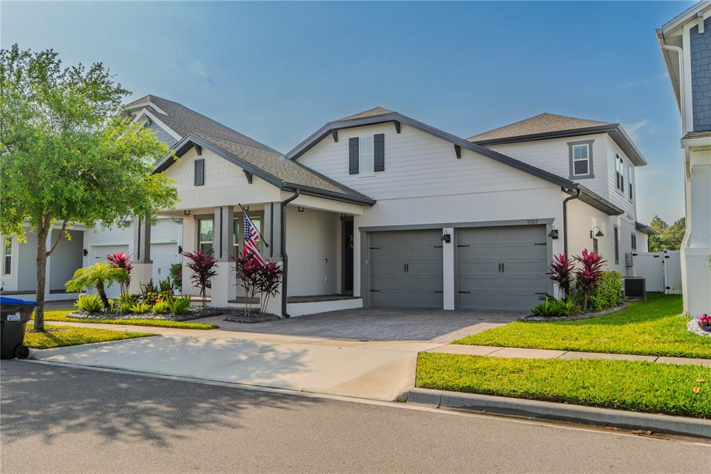 15313 Lebeau Loop Winter Garden, FL 34787 - Photo 1 of 1 a view of a white house with fountain in front of a house