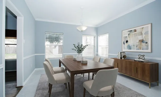 a dining room with furniture and window