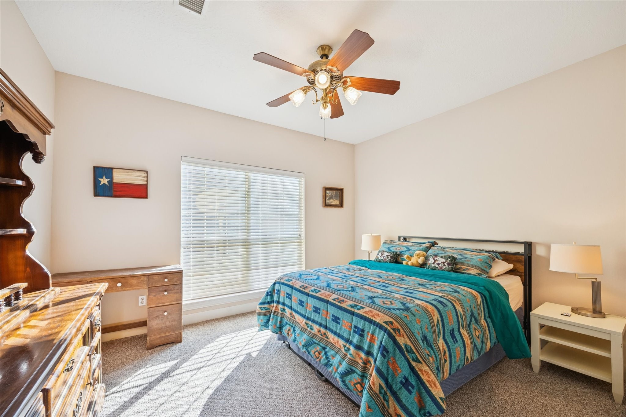 32410 Phlying Road Waller, TX 77484 - Photo 15 of 26 a bedroom with a bed and a chandelier