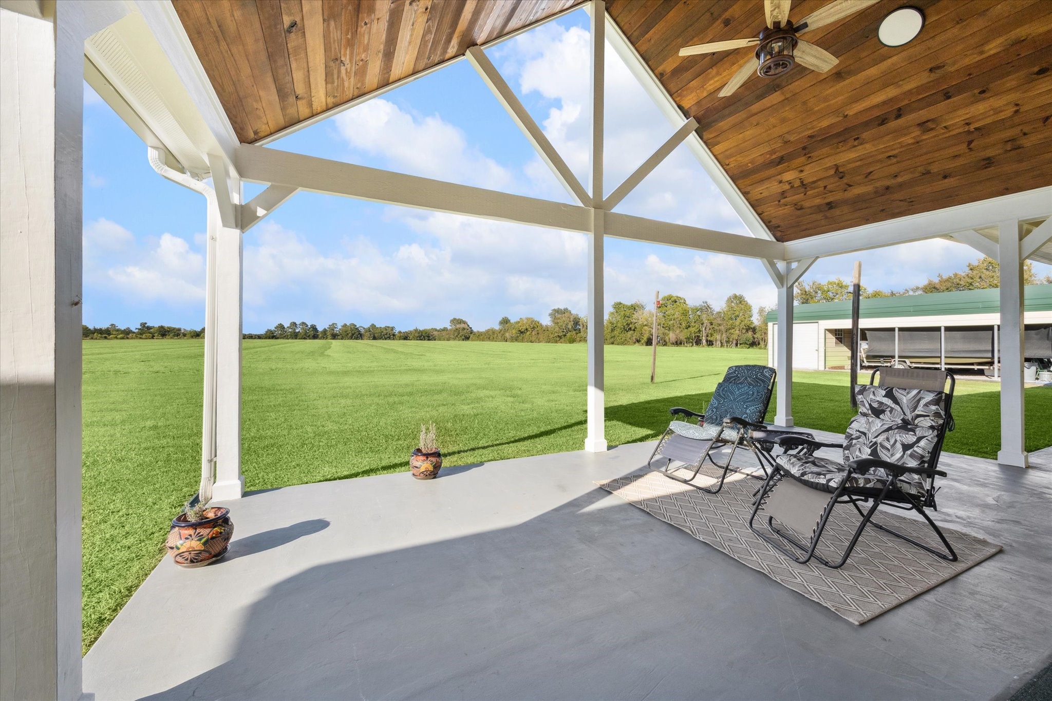 32410 Phlying Road Waller, TX 77484 - Photo 16 of 26 a view of a patio with a table chairs and backyard