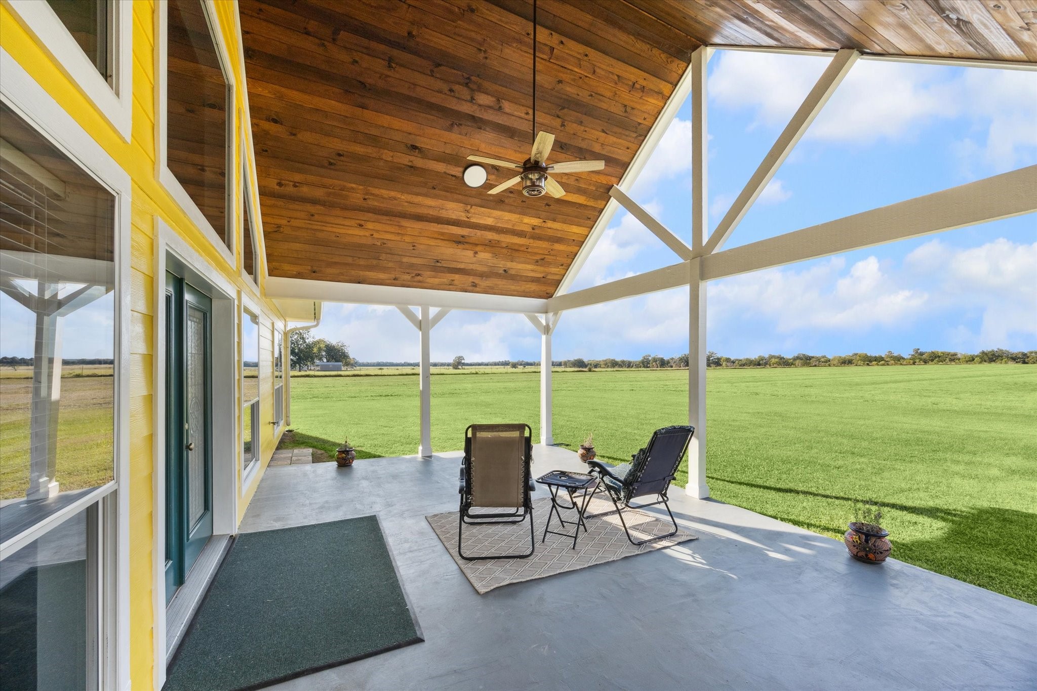 32410 Phlying Road Waller, TX 77484 - Photo 17 of 26 a view of a patio with a table chairs and a swimming pool