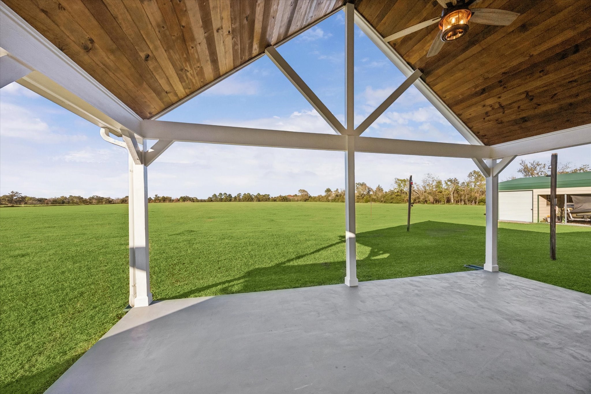 32410 Phlying Road Waller, TX 77484 - Photo 18 of 26 a view of a house with backyard and porch