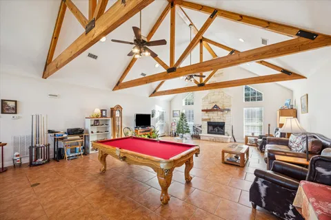 a kitchen with stainless steel appliances granite countertop a sink a stove and cabinets