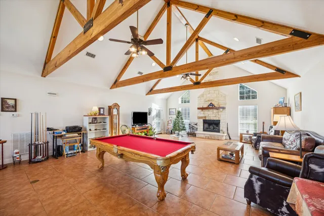 a kitchen with stainless steel appliances granite countertop a sink a stove and cabinets