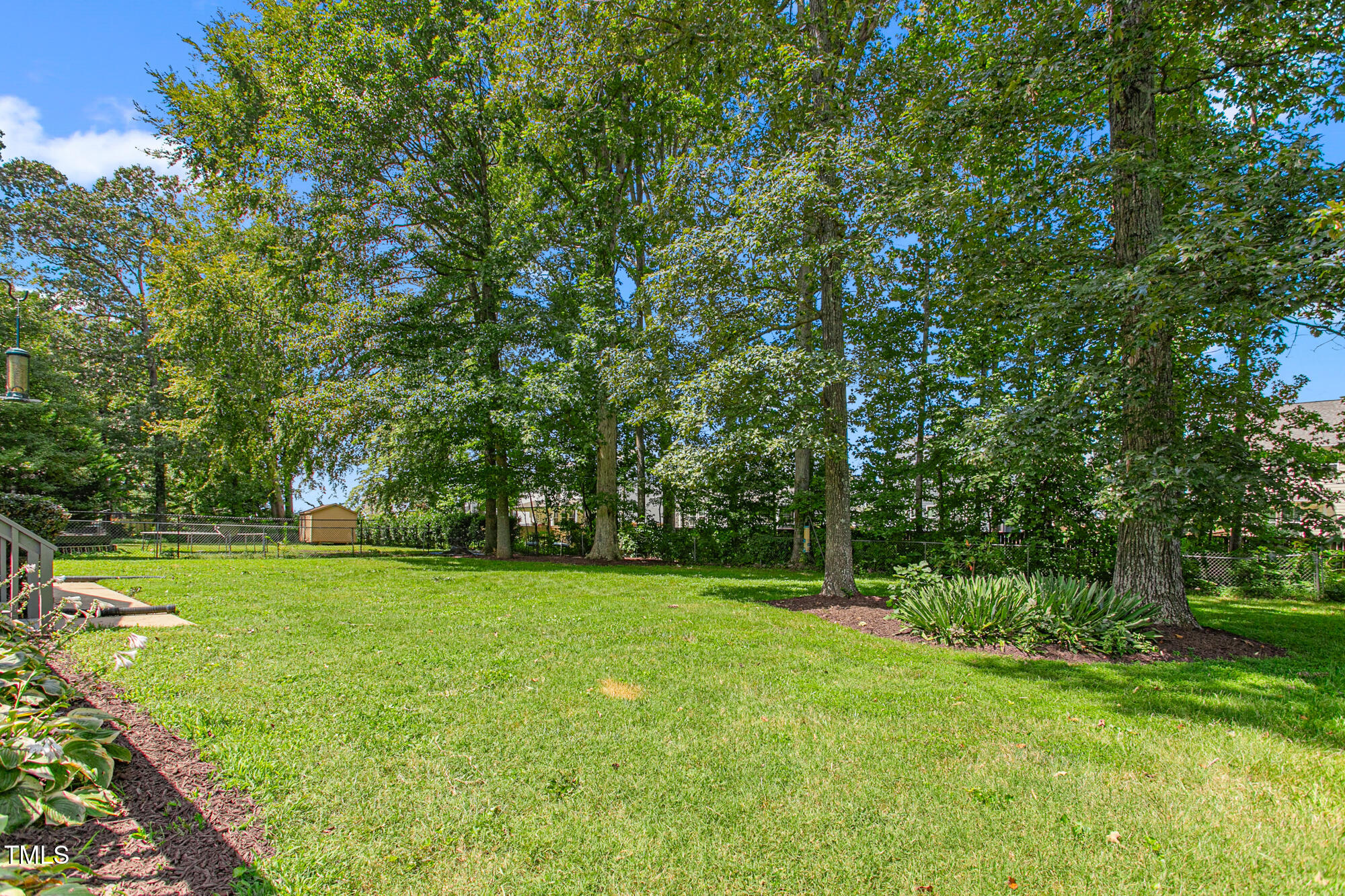 809 Brookview Drive Elon, NC 27244 - Photo 37 of 53 a view of a grassy field with trees