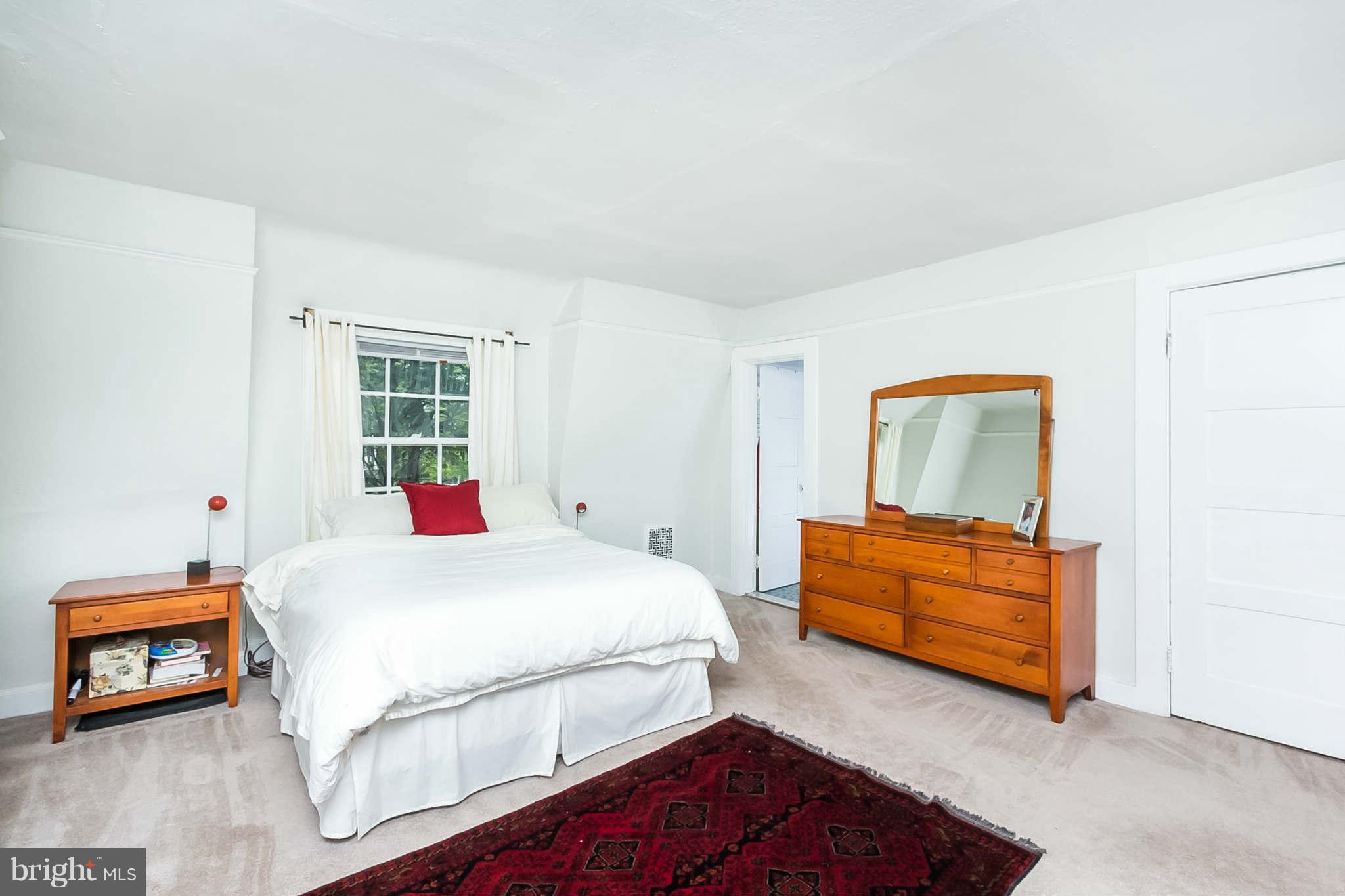 4819 Keswick Road Baltimore, MD 21210 - Photo 15 of 28 a bedroom with a bed and a window
