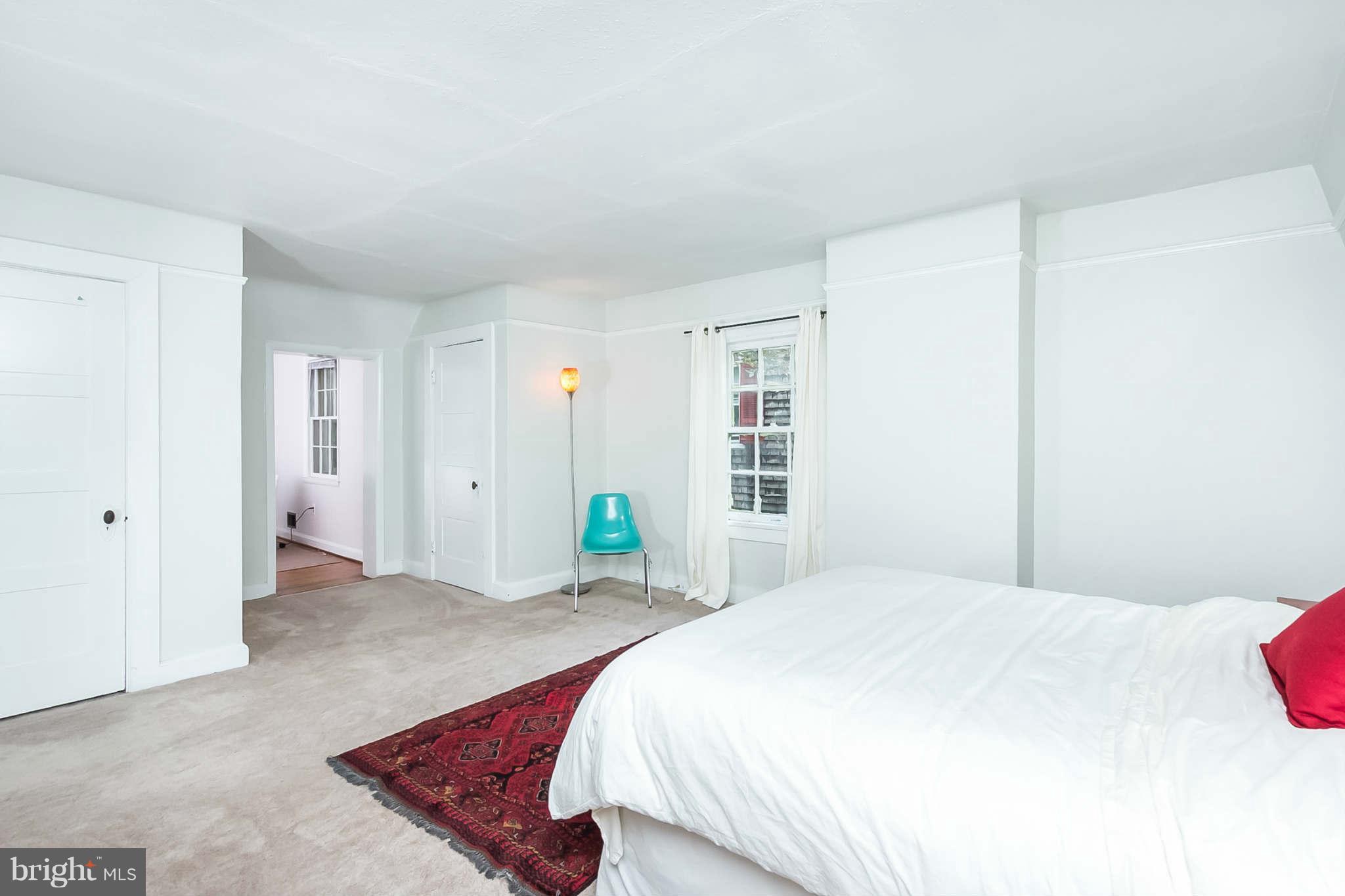 4819 Keswick Road Baltimore, MD 21210 - Photo 16 of 28 a bedroom with a bed and a window