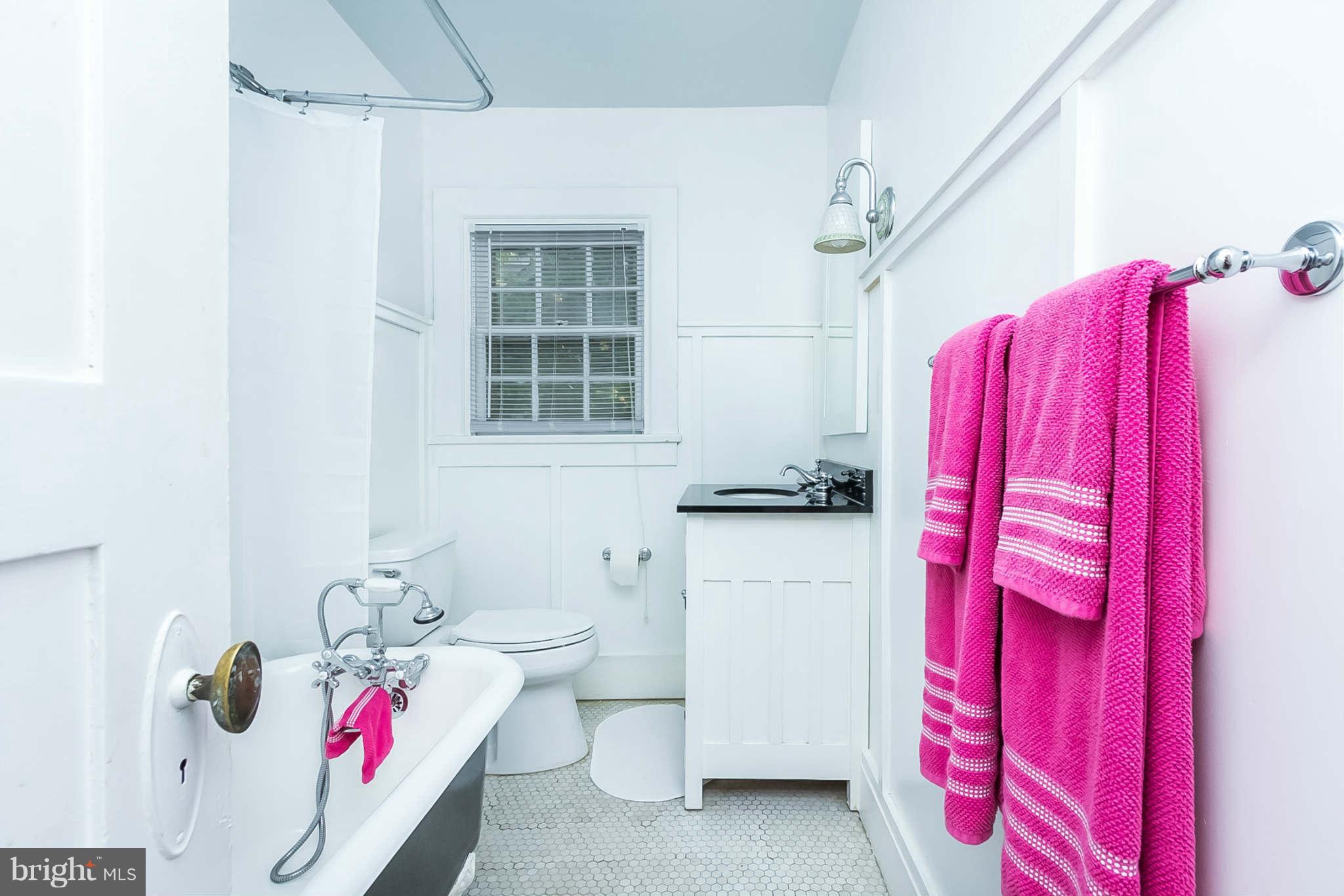 4819 Keswick Road Baltimore, MD 21210 - Photo 20 of 28 a bathroom with a sink toilet and shower