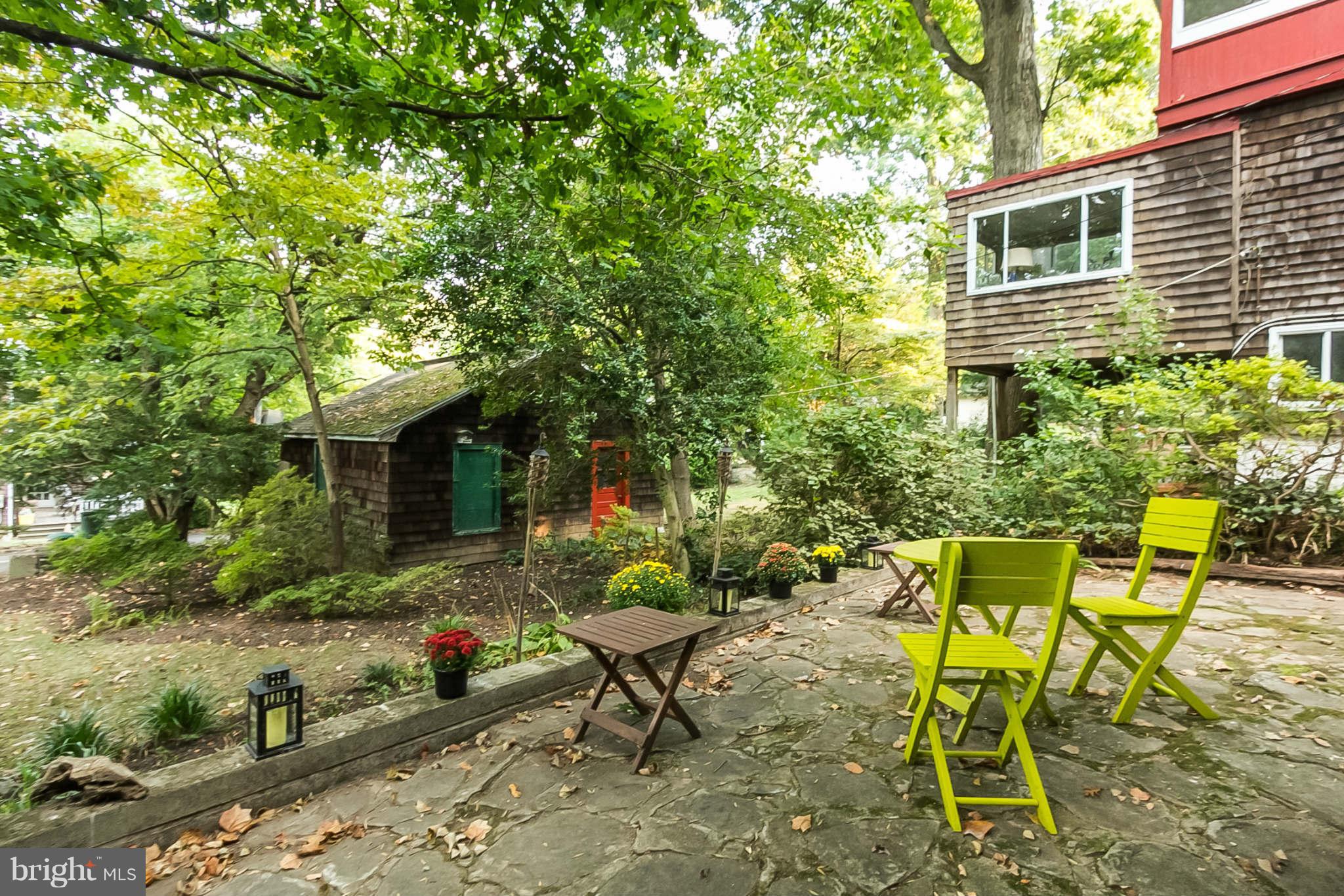 4819 Keswick Road Baltimore, MD 21210 - Photo 27 of 28 a backyard of a house with table and chairs