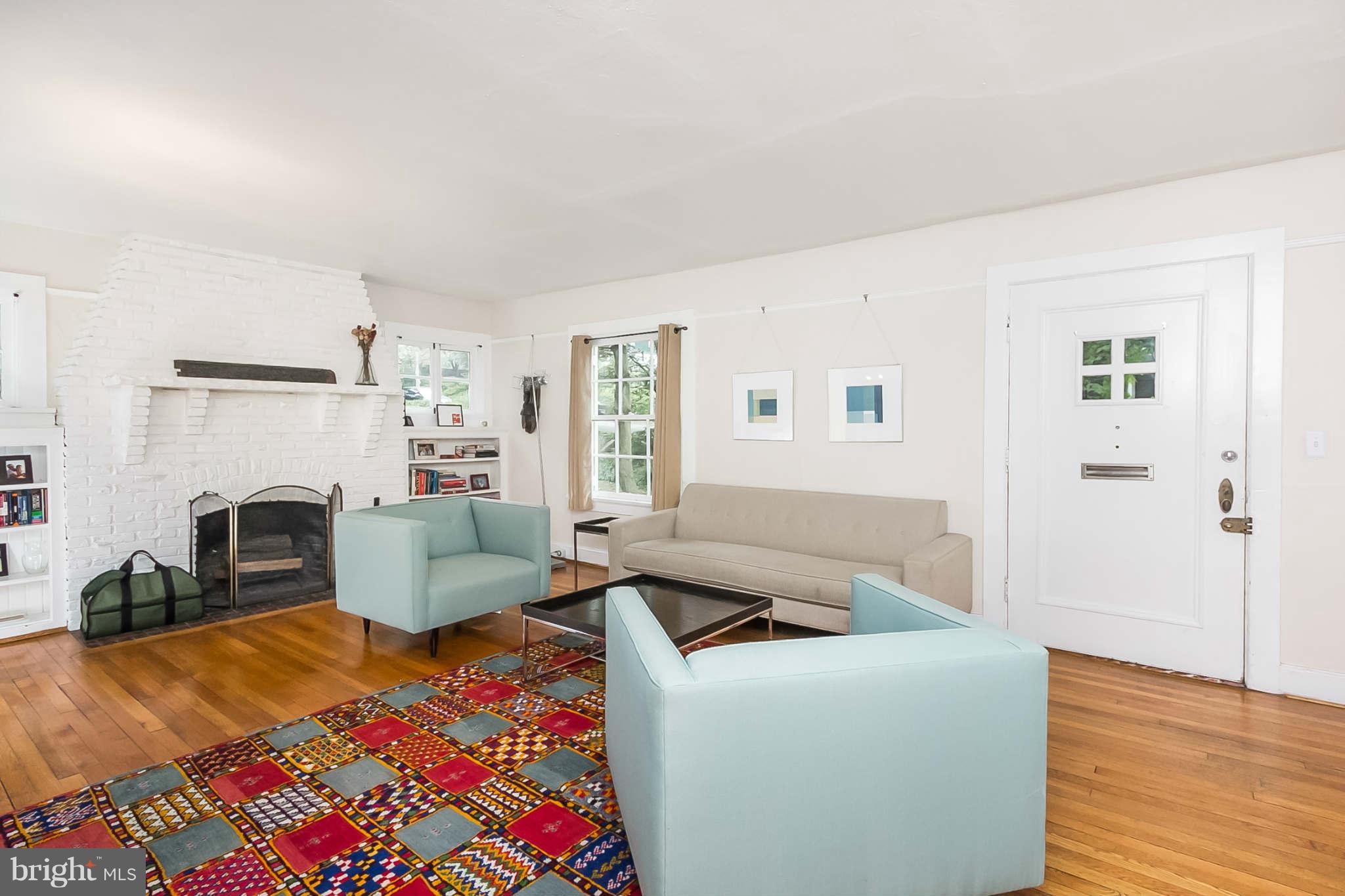 4819 Keswick Road Baltimore, MD 21210 - Photo 5 of 28 a living room with furniture and a fireplace