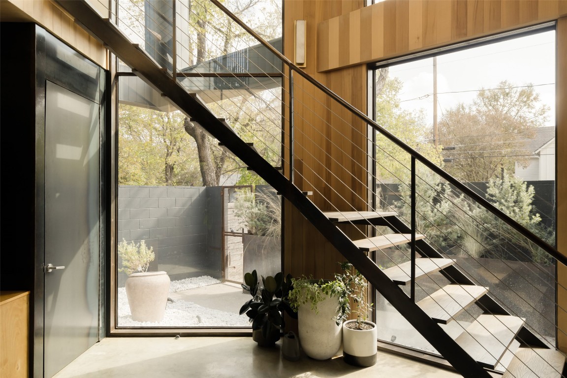2302 East 11th Street Austin, TX 78702 - Photo 14 of 40 a view of entryway with wooden floor and stairs
