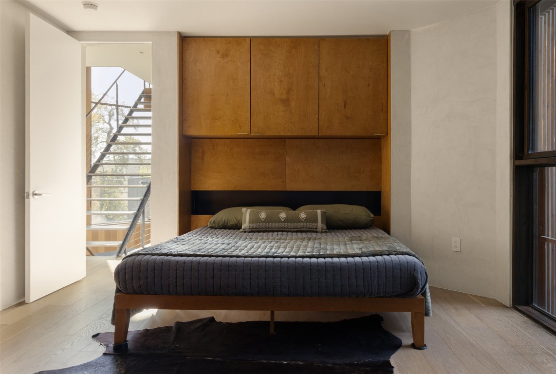 2302 East 11th Street Austin, TX 78702 - Photo 17 of 40 a bedroom with a bed and a window