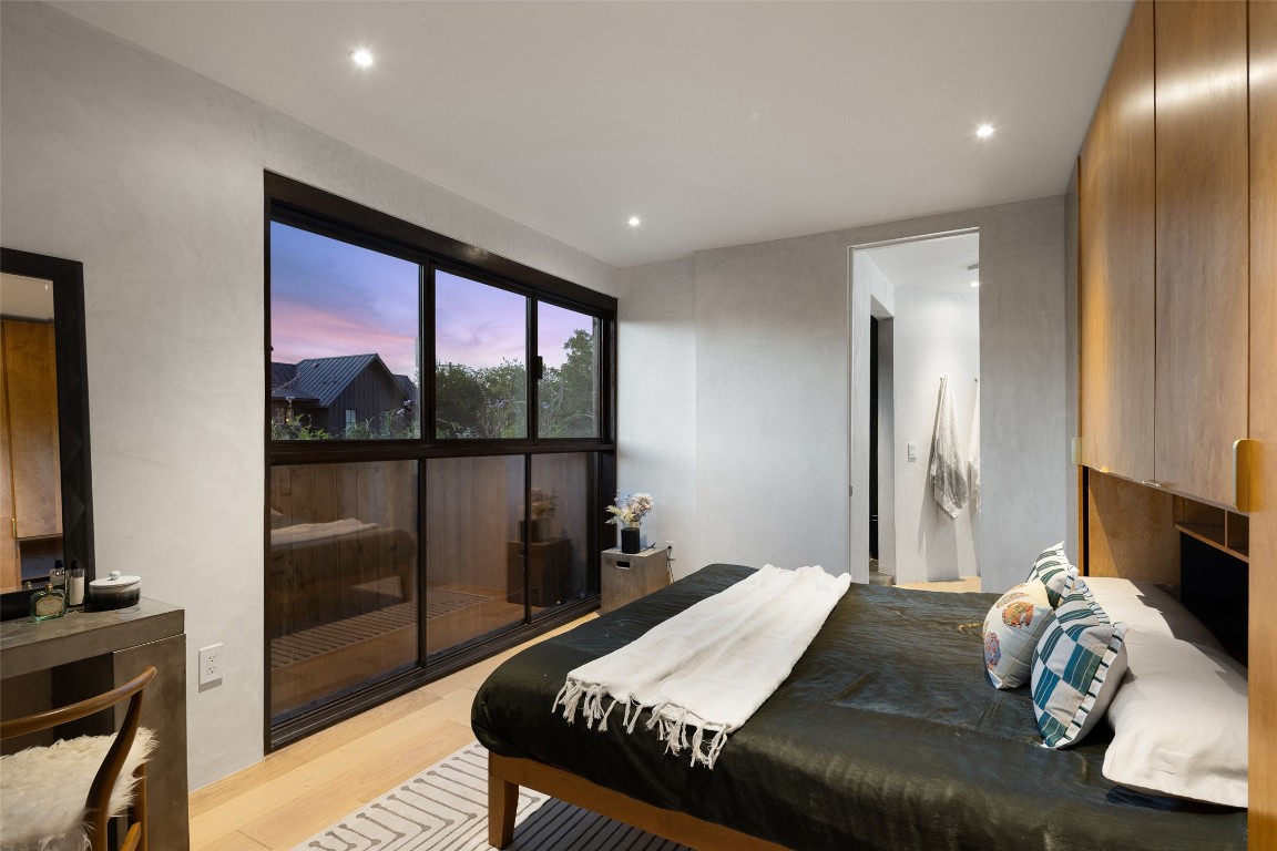 2302 East 11th Street Austin, TX 78702 - Photo 18 of 40 a bed room with a bed and a window